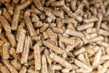 Biofuels. Sawdust alternative fuels. Wood pellet texture background