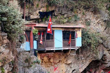 Vasuki meditation cave in Pashupatinath Temple in Kathmandu, Nepal, small ascetic building on slope...