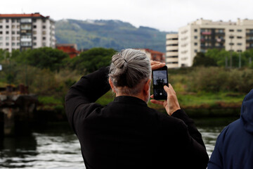 Man taking a photo with his smartphone