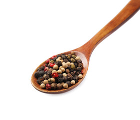 Aromatic spices. Different peppers in wooden spoon isolated on white