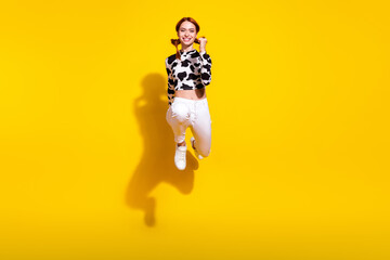 Full length portrait of charming energetic person jump run empty space isolated on yellow color...