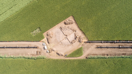 Aerial view of gas and oil pipeline construction and archeological excavations. Big pipeline is...