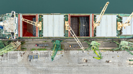 General cargo ship is loaded with metal pipes. Pipes for gas and oil pipeline construction