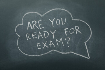 Chalk writing on the blackboard: "Are you ready for the exam?".