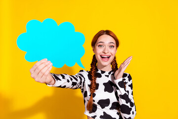 Photo of positive impressed woman wear cow skin print top rising talking cloud empty space isolated...