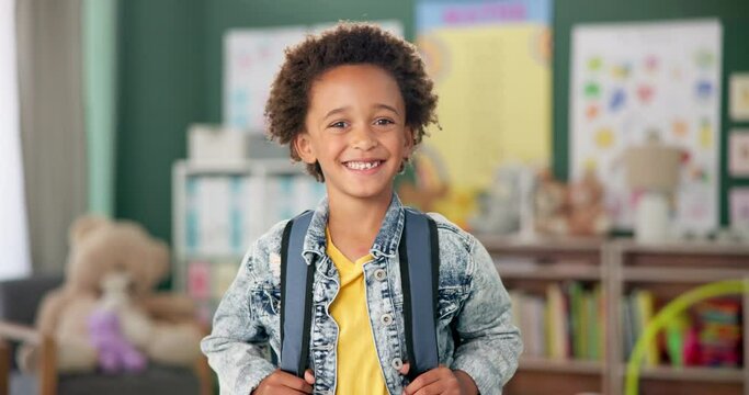Smile, face and student in classroom for education, learning and ready for morning kindergarten. Happy, school and portrait of boy or child with knowledge, studying and pride for academic lesson