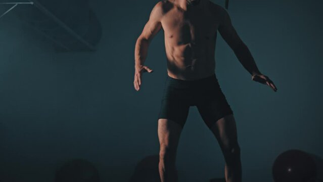 Guy balances himself on exercise ball