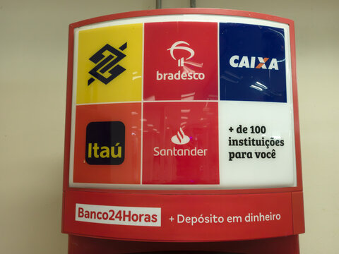 RIO DE JANEIRO, BRAZIL - April 20, 2024: Sign with Group of supermarket 24-hour ATM banks. Logos of Banco do Brail, Bradesco, Caixa Econ&ocirc;mica Federal, Santander and Ita&uacute;