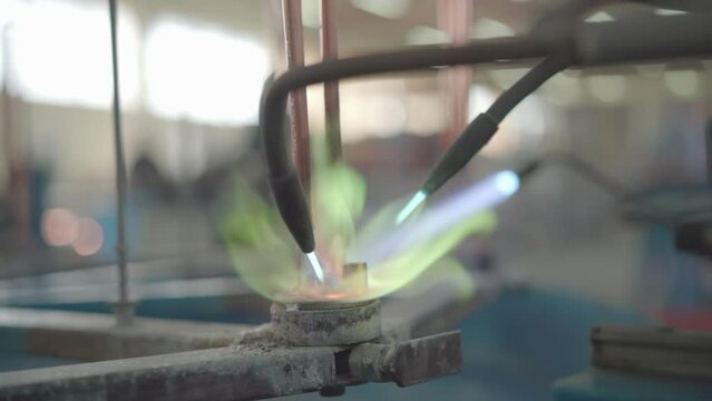 Factory production of heating element. Welding of Heating exchanger in workshop. Manufacturing heating element. Mass factory production.
