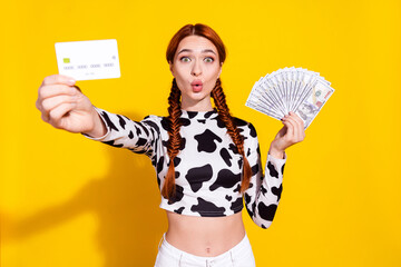 Photo of excited funky woman wear cow skin print top choosing credit card instead cash isolated...