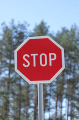 Stop sign on blue sky