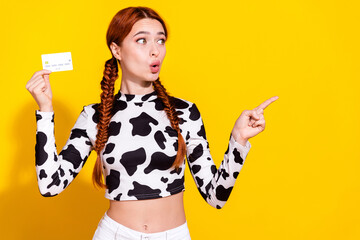 Photo of shiny shocked woman wear cow skin print top holding credit card looking showing empty...