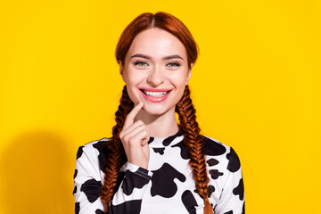 Photo of sweet tricky woman wear cow skin top smiling finger chin isolated yellow color background
