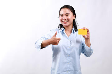 Young asian woman in formal clothes showing blank card and thumb up gesture, approve and recommend,...