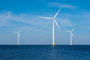 A group of elegant wind turbines stands tall in the ocean in the Netherlands Flevoland, harnessing...