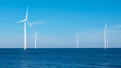 A majestic row of wind turbines rises from the ocean in the Netherlands Flevoland, harnessing the...