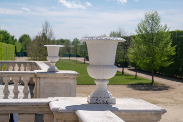 Obraz premium detail of a regal park, with architectural elements and baroque decoration, for very scenic perspective views. elegant chalice vase with Italian garden background. Venaria, Turin, italy