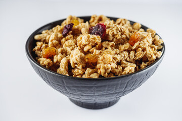 delicious crunchy granola with dried fruits on a white background