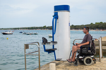 Swimming lift at sea for people with disability. Accessible beach and access to water.