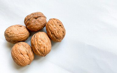Dried walnuts isolated on white background with copy space for text. Top view, flat lay.