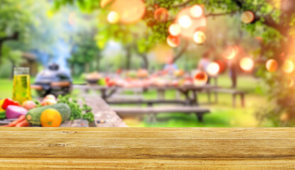 summer time party in backyard garden with grill BBQ and vegetables, wooden table, blurred background