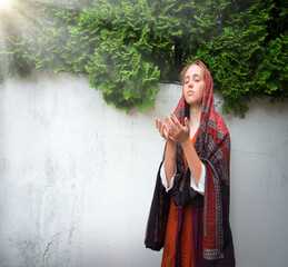Praying girl in the yard