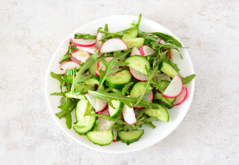 salad with radish in white bowl top view close up