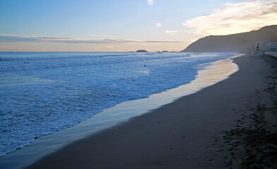 Waves coming in during sunrise in Zarautz, Spain