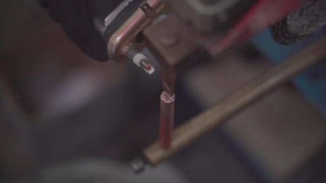 Factory production of heating element. Punctuation or point welding of Heating exchanger in workshop. Close up.