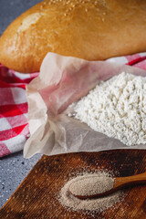 Granulated dry yeast on a dark rustic background