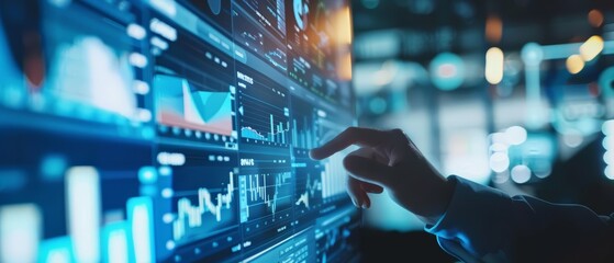 A businessperson in a dark room is using a futuristic touch screen interface to analyze complex data sets