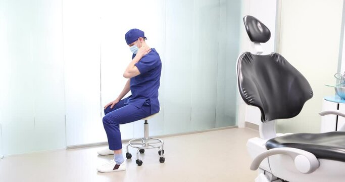 Sitting dentist, dealing with neck pain.Symptoms and self help exercises, stretching. Profile view.