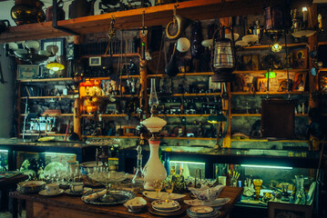 An antique shop with vintage items lining the shelves, showcasing antique treasures.