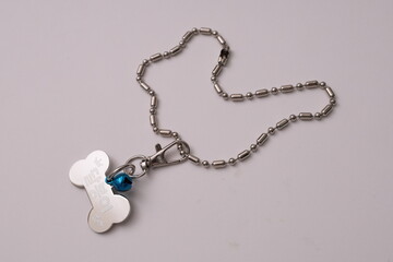 a cat and dog's name tag necklace
