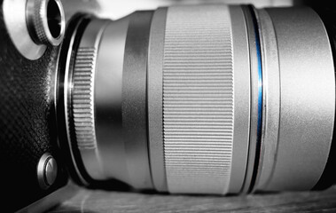 Black & white camera lens with blue line object backdrop