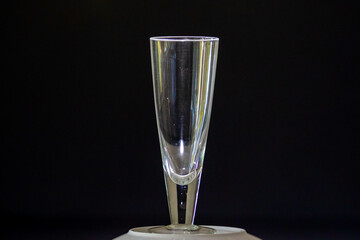 Traditional empty crystal glass for beer isolated on black background and selective focus