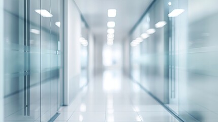 Fototapeta premium Empty white corridor with glass walls. Blurred motion image in blue and white tones. Medical facility concept. Design for healthcare posters and presentations. Wide angle perspective with copy space.