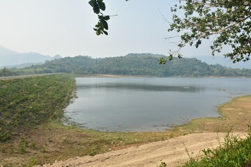 landscape of Klong bot water reservoir lake with mountain background in Thailand 