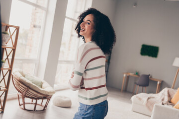 Photo of cheerful positive lady dressed striped pullover laughing arms crossed indoors apartment...