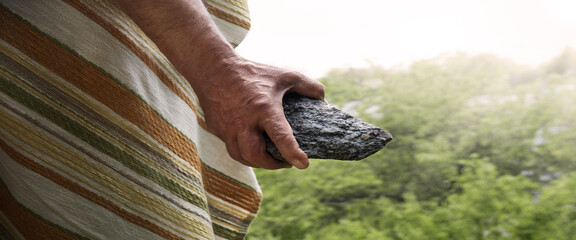 Male hand with big stone