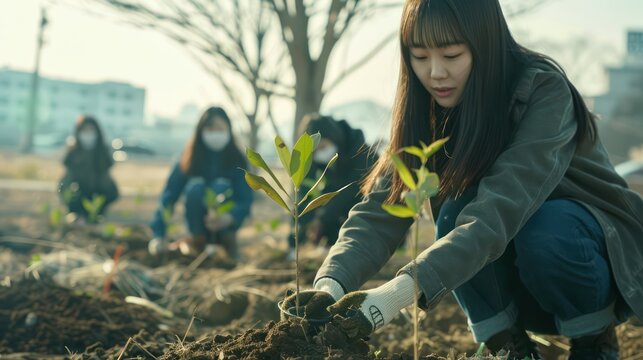 potrait a Korean woman and her group of volunteers planting plants to protect the environment, eco concept