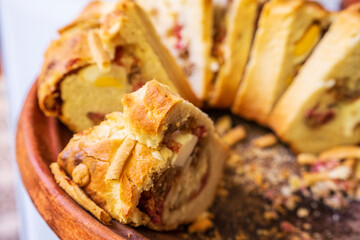 tortano napoletano , Neapolitan Easter cake, savory donut filled with cured meats and cheeses