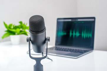 Podcast equipment: microphone and laptop