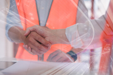 Businessmen or foreman handshake with partner greeting dealing merger and acquisition, business joint venture concept, teamwork and successful business with blurred background