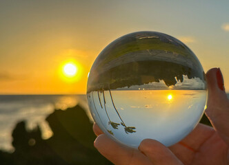 Big Island sun setting in Hawaii through lensball 