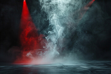 Cool grey smoke abstract background swirling on a stage illuminated by a scarlet red spotlight, enhancing the drama against a black background.