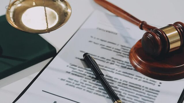 Professional male lawyer or counselor discussing negotiation legal case with client meeting with document contract in office, law and justice, attorney, lawsuit concept.