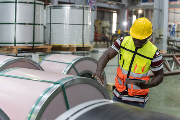 Black man factory worker working in metal sheet manufacturing industrial