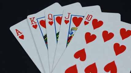 poker cards on desk isolated on dark background
