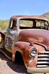 old rusty truck abandoned in the desert